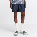 Oblique Swim Shorts – crafted in navy blue technical fabric, they are enhanced by a side flap pocket – LUX VERSE Luxury Designer Fashion Outlet
