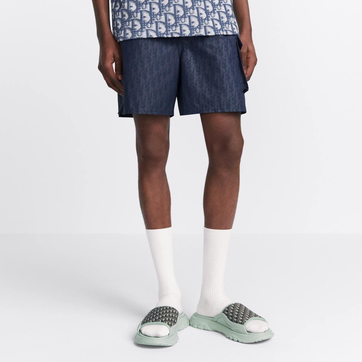 Oblique Swim Shorts – crafted in navy blue technical fabric, they are enhanced by a side flap pocket – LUX VERSE Luxury Designer Fashion Outlet
