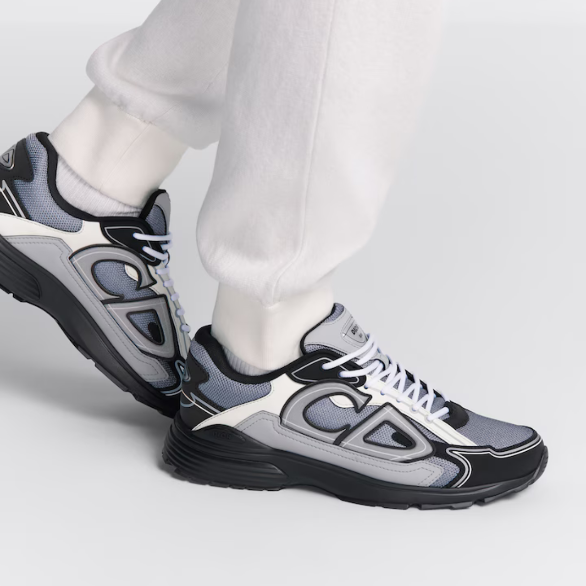 B30 Sneaker – crafted in blue mesh and gray, white and black technical fabric, it is enhanced by – LUX VERSE Luxury Designer Fashion Outlet