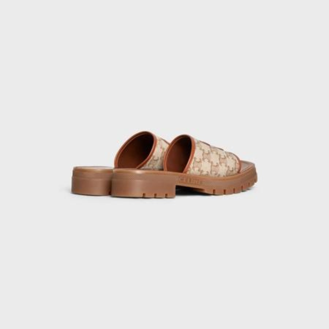 TRIOMPHE SLIDE in TRIOMPHE STAMPED CANVAS & CALFSKIN – 90% COTTON, 10% CALFSKINLINING 100% COTTON1.6 IN (40 MM) heelTRIOMPHE – LUX VERSE Luxury Designer Fashion Outlet