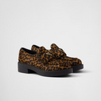 Chocolate printed leather loafers – upper with leather band Enameled metal triangle logo Monoblock rubber sole, 50 mm, – LUX VERSE Luxury Designer Fashion Outlet