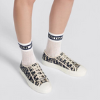 Walk'n'Elevated Cotton Sneaker – its relaxed design features signatures on the tongue, rubber sole and laces for – LUX VERSE Luxury Designer Fashion Outlet