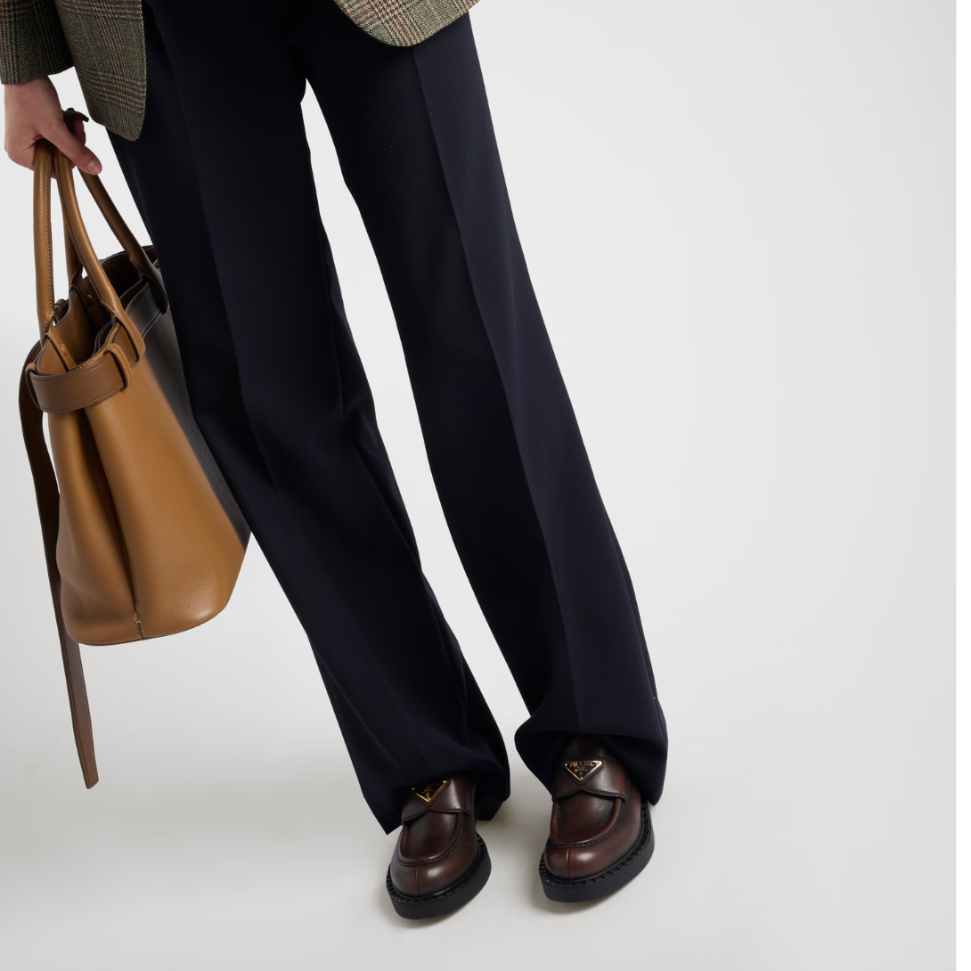 Chocolate leather loafers – the enameled metal triangle logo completes the iconic footwear – LUX VERSE Luxury Designer Fashion Outlet