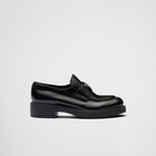 Chocolate brushed leather loafers – upper with leather strap Enameled metal triangle logo 50 mm rubber monobloc sole – LUX VERSE Luxury Designer Fashion Outlet