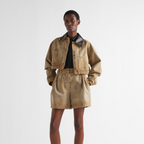 Cropped canvas jacket – the utility-inspired garment, enriched by patch pockets and leather collar, is – LUX VERSE Luxury Designer Fashion Outlet