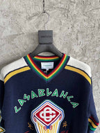 Navy Wollpullover mit Rundhalsausschnitt und Wappen-Intarsie – Herren