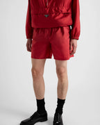 Re-Nylon swim trunks – the style with a classic silhouette, characterized by the elasticized waistband, is – LUX VERSE Luxury Designer Fashion Outlet