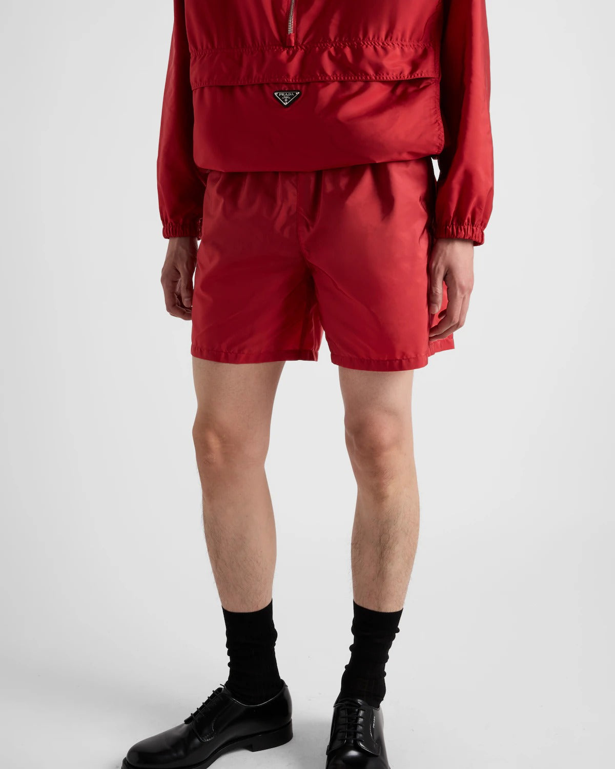 Re-Nylon swim trunks – the style with a classic silhouette, characterized by the elasticized waistband, is – LUX VERSE Luxury Designer Fashion Outlet