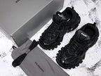 Track All Black Sneakers