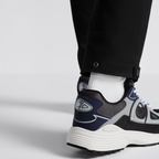 B30 Sneaker – crafted in blue mesh and gray, white and black technical fabric, it is enhanced by – LUX VERSE Luxury Designer Fashion Outlet