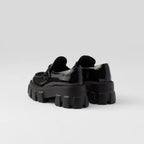 Monolith patent leather loafers – these bold, original loafers stand out for their hybrid design emphasized by – LUX VERSE Luxury Designer Fashion Outlet