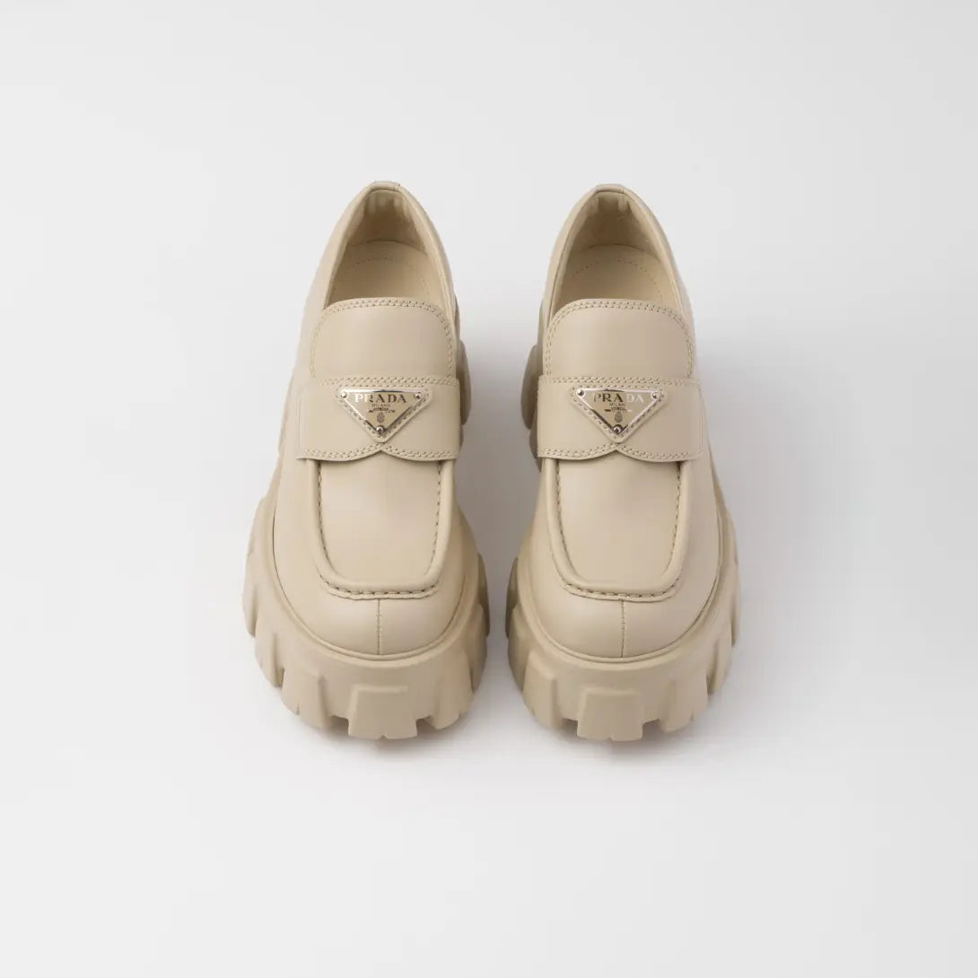 Brushed leather Monolith loafers – upper with leather band and metal triangle logo Apron with stitched raised edge – LUX VERSE Luxury Designer Fashion Outlet