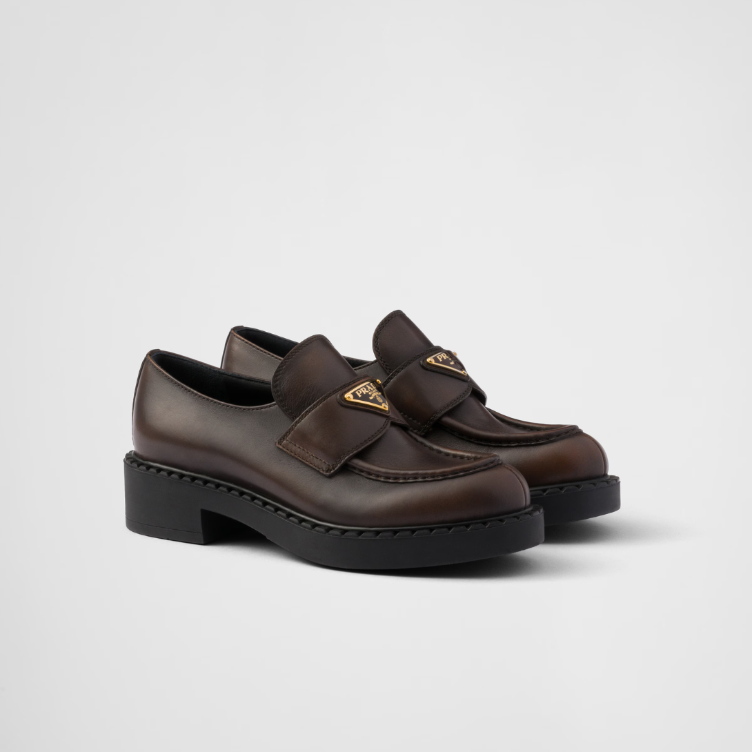 Chocolate leather loafers – upper with leather band Enameled metal triangle logo Monoblock rubber sole, 50 mm, – LUX VERSE Luxury Designer Fashion Outlet
