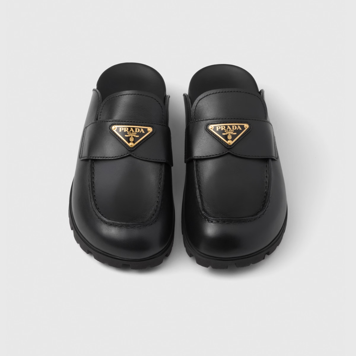 Leather mules – upper with leather band Leather lining Enameled metal triangle logo Rubber sole, – LUX VERSE Luxury Designer Fashion Outlet