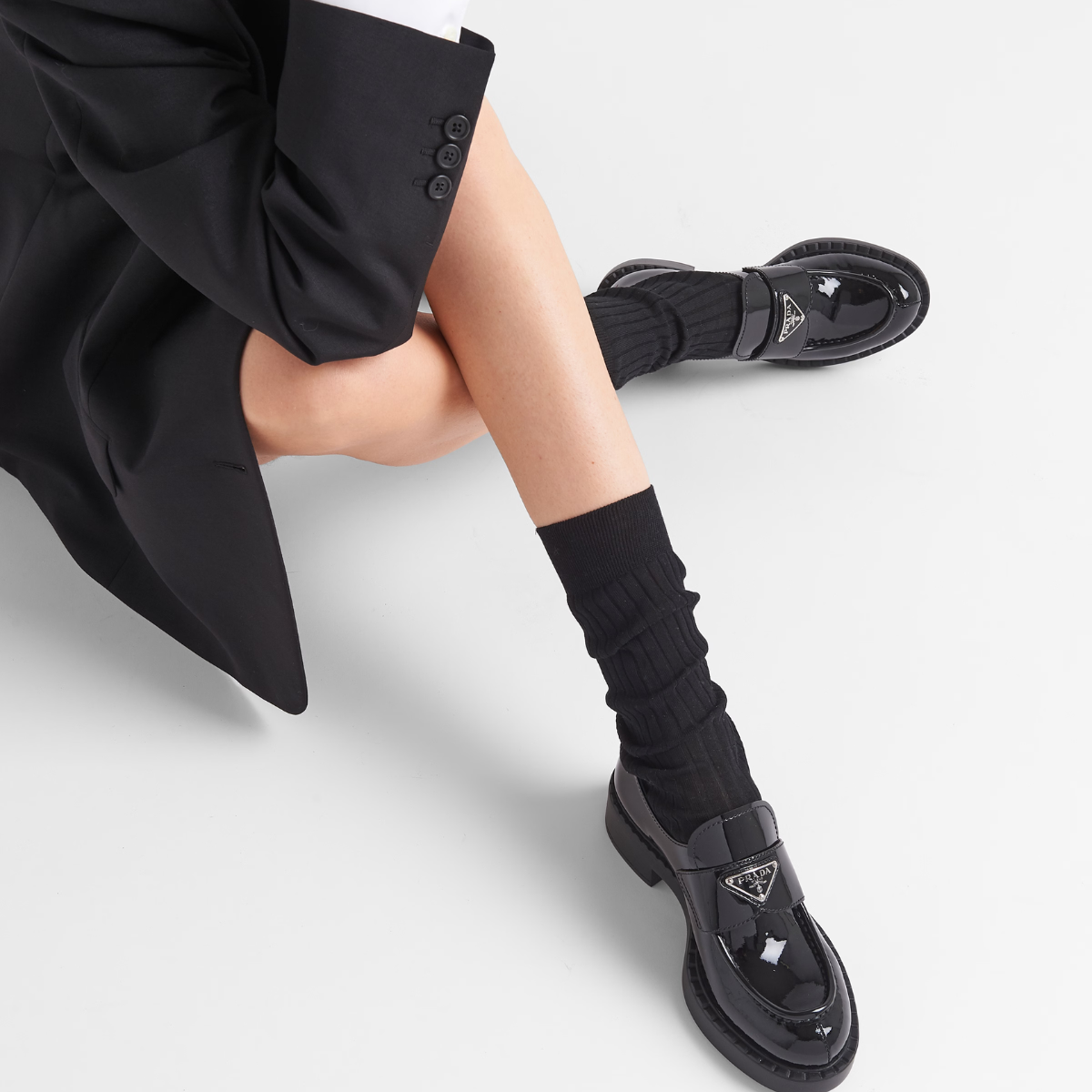 patent leather loafers – the triangle logo, first introduced on trunks designed by Mario, decorates the front – LUX VERSE Luxury Designer Fashion Outlet