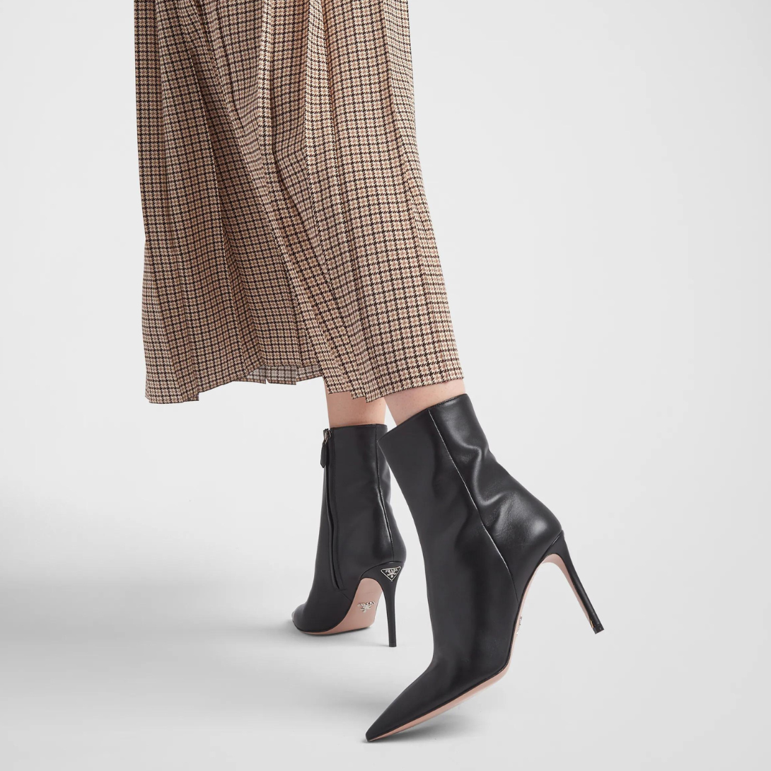 Nappa leather booties – the iconic metal lettering logo embellishes the leather sole – LUX VERSE Luxury Designer Fashion Outlet