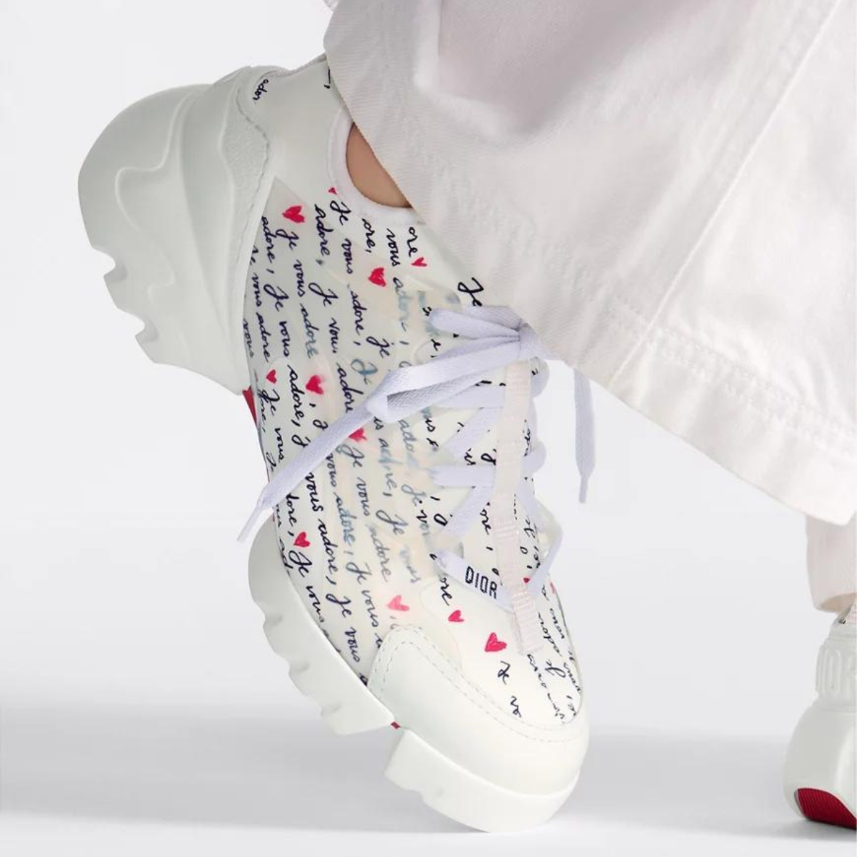 D-Connect Sneaker – part of capsule, the D-Connect sneaker showcases the black and red Je Vous Adore (I – LUX VERSE Luxury Designer Fashion Outlet