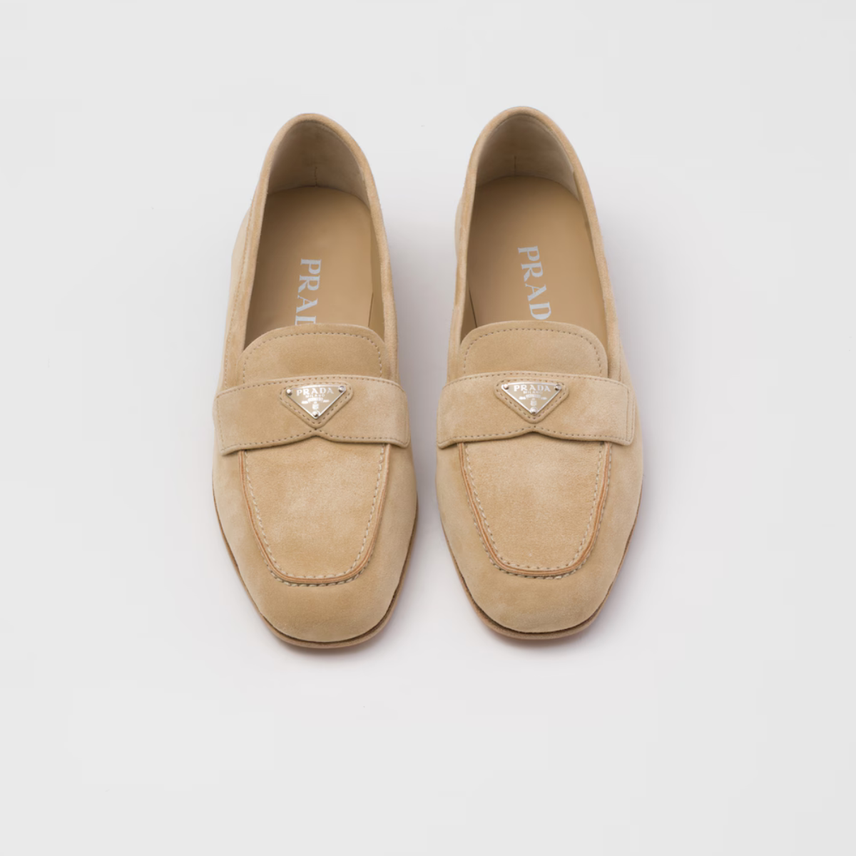 Suede loafers Ecru – upper with a suede band Enameled metal triangle logo Monoblock leather sole – LUX VERSE Luxury Designer Fashion Outlet