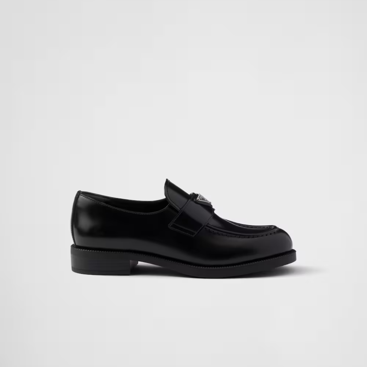 Elegant Brushed leather Black loafers – the enameled metal triangle logo completes the look with its simple yet distinctive – LUX VERSE Luxury Designer Fashion Outlet