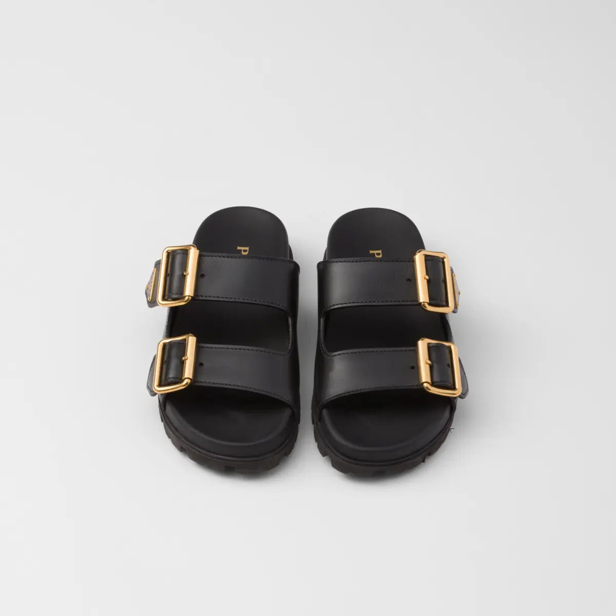 Suede strap slides – the enameled metal triangle logo embellishes the style with its sleek and iconic – LUX VERSE Luxury Designer Fashion Outlet