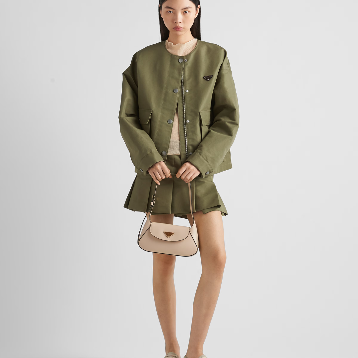 Technical Canvas Jacket – the iconic enameled metal triangle logo adds its signature to the pragmatic – LUX VERSE Luxury Designer Fashion Outlet