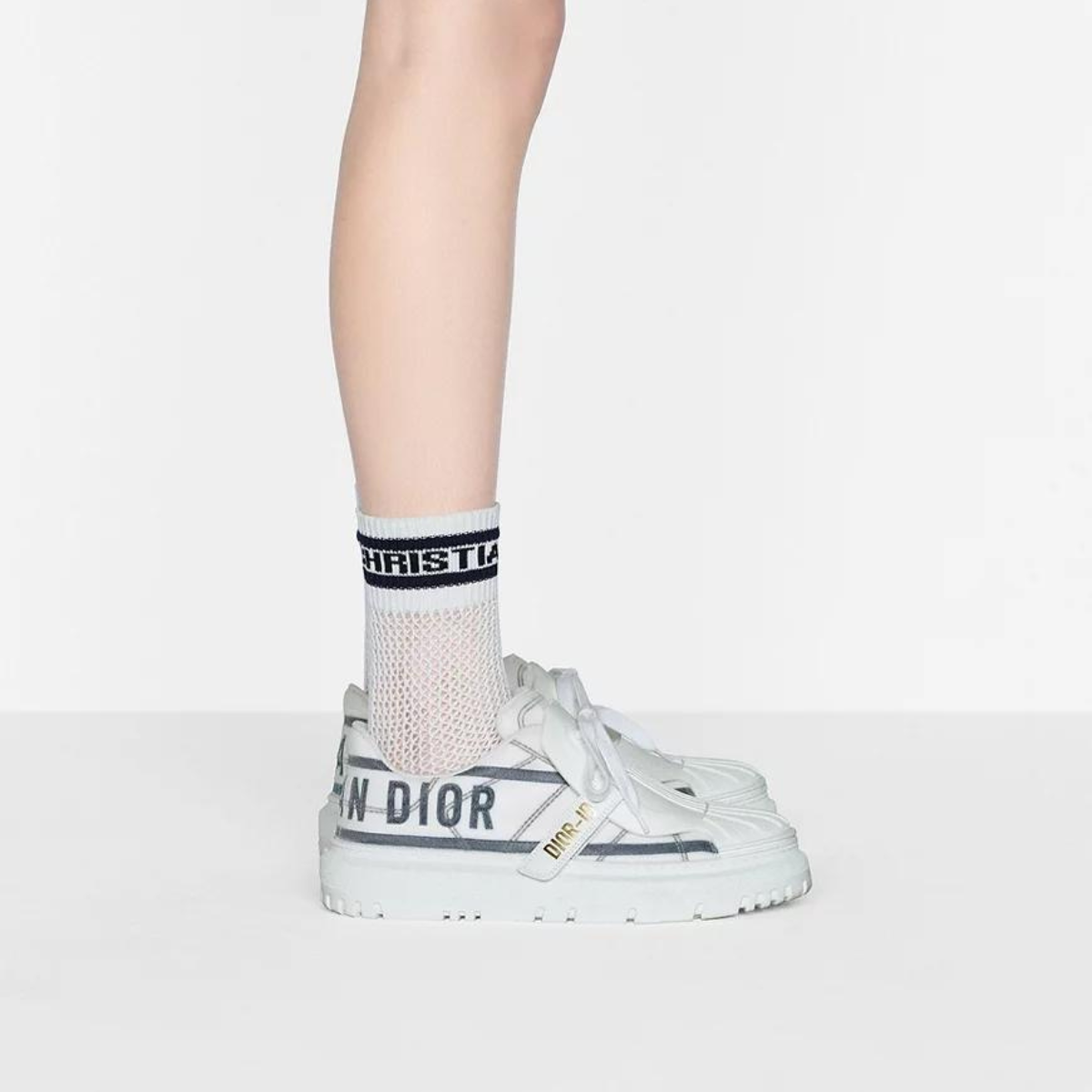 ID Sneaker – the textured-effect French blue'CHRISTIAN PARIS'signature adorns the rear – LUX VERSE Luxury Designer Fashion Outlet