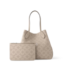 Blossom MM – it’s signed with a leather tag, featuring perforated Initials circled in leather – LUX VERSE Luxury Designer Fashion Outlet