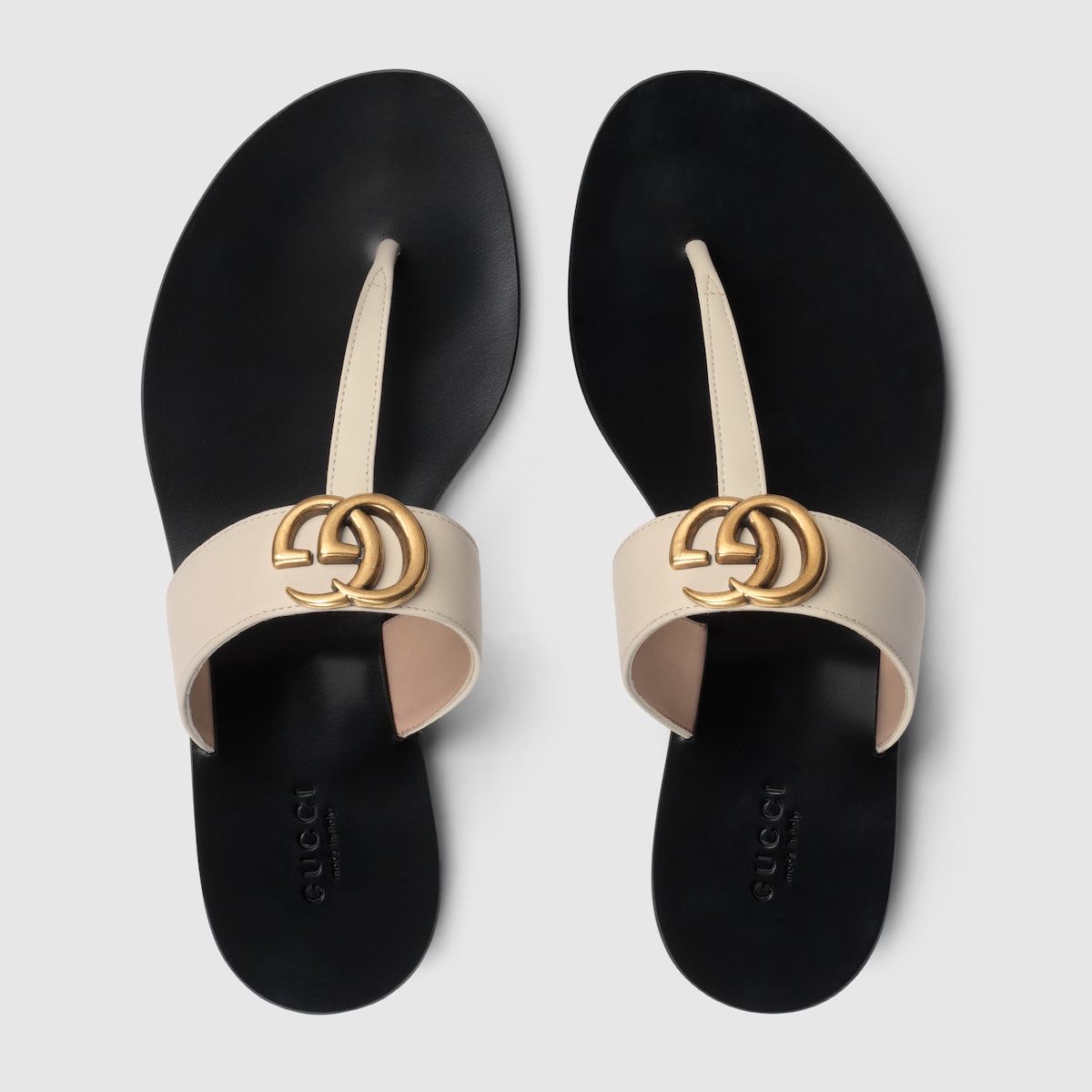 Women's thong sandal with Double G – the antique gold-toned detail defines a pair of flat white leather thongs – LUX VERSE Luxury Designer Fashion Outlet