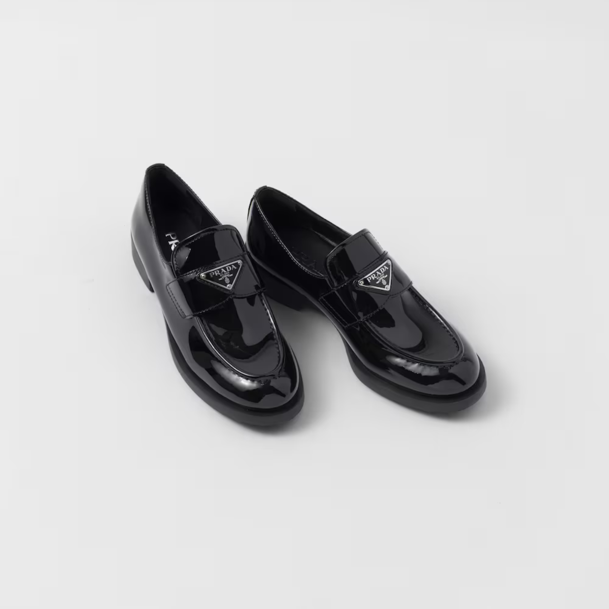 Patent Glossy Finish leather loafers – upper with leather band Enameled metal triangle logo Rubber monoblock sole – LUX VERSE Luxury Designer Fashion Outlet