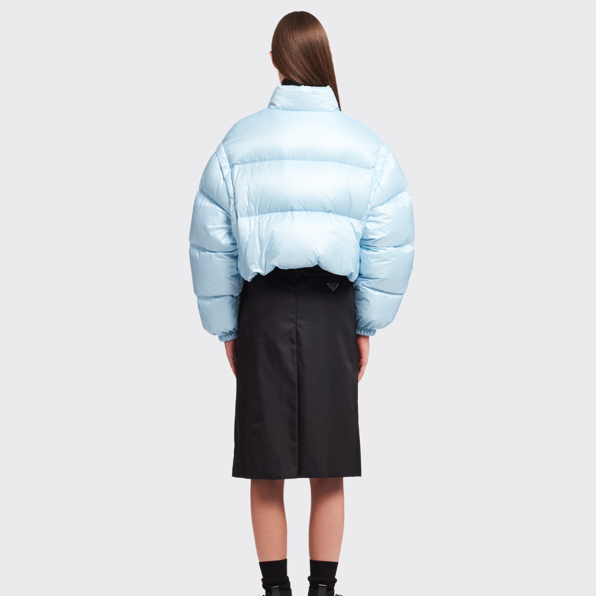 Re-Nylon cropped convertible down jacket – padded with goose down, the garment is decorated with the iconic enameled metal – LUX VERSE Luxury Designer Fashion Outlet