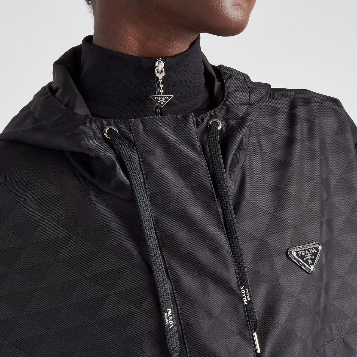 Printed Re-Nylon jacket – first introduced on trunks designed by Mario, the triangle expresses uniqueness – LUX VERSE Luxury Designer Fashion Outlet