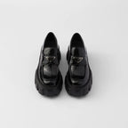 Monolith patent leather loafers – upper with leather band and metal triangle logo Apron with stitched raised edge – LUX VERSE Luxury Designer Fashion Outlet