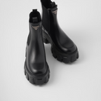 Monolith brushed leather booties – these original, bold booties enhance the duality concept that is fundamental in – LUX VERSE Luxury Designer Fashion Outlet