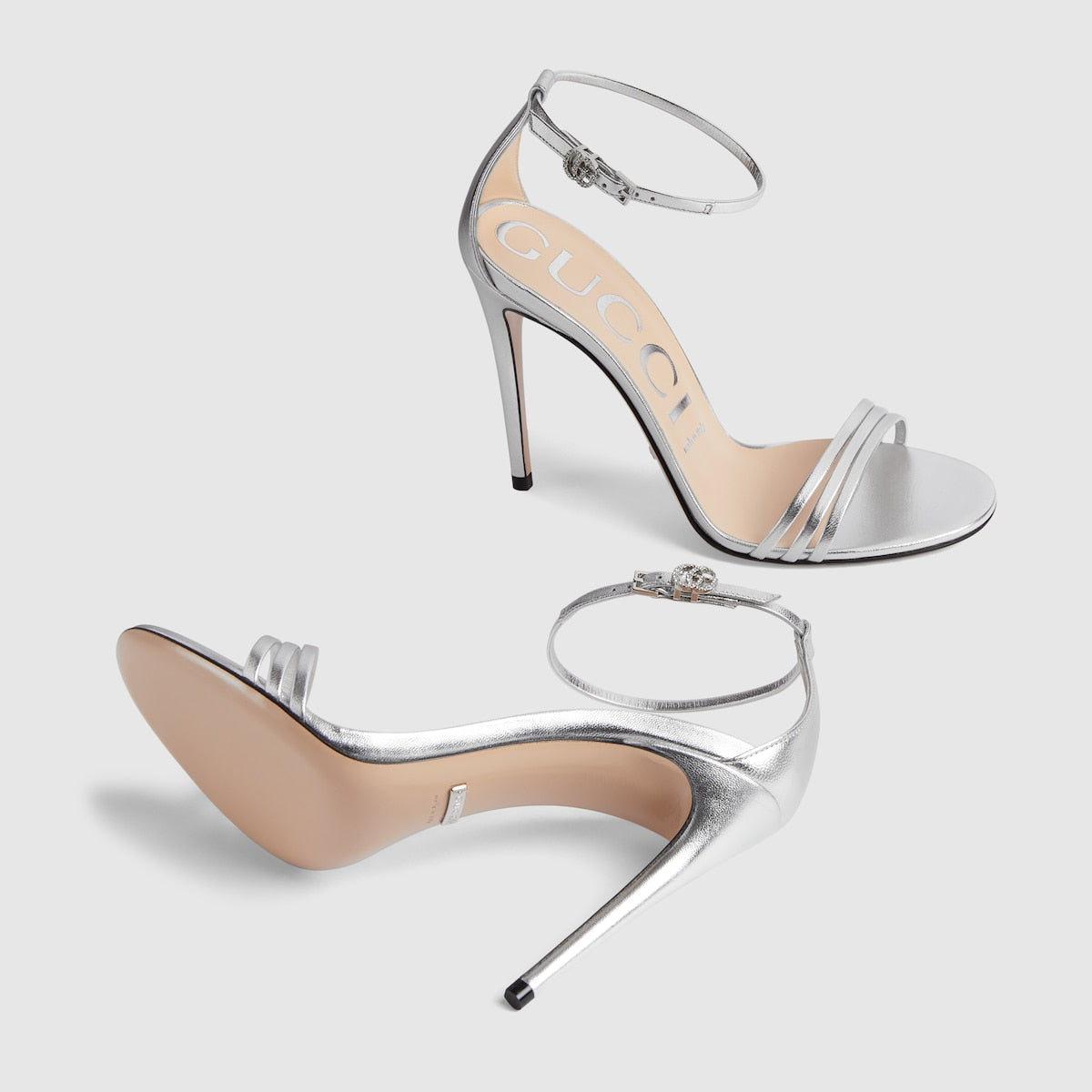 Heeled sandal with Double G – crafted in metallic platinum leather, the high-heel sandal sports a subtle design – LUX VERSE Luxury Designer Fashion Outlet