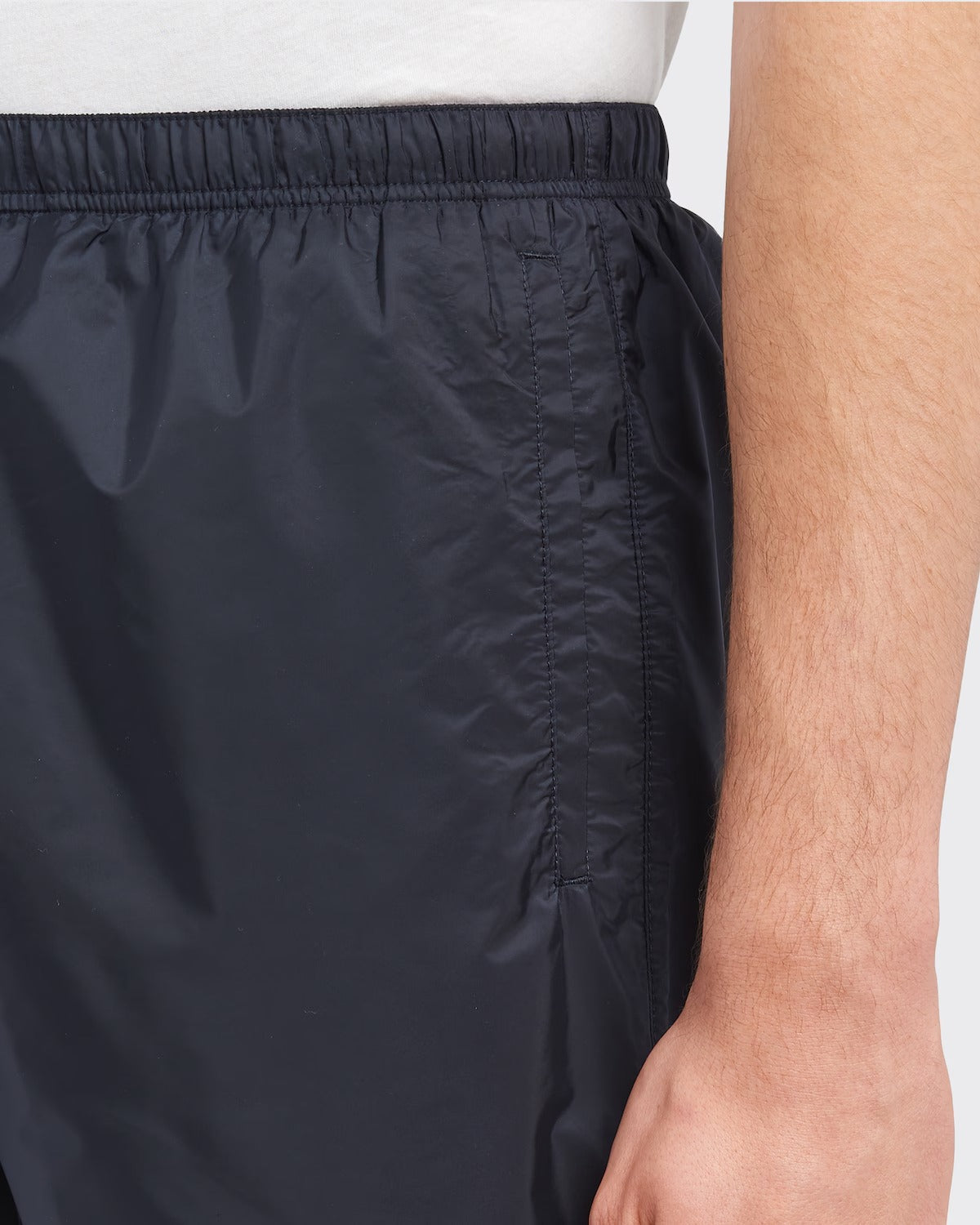 Re-Nylon swim trunks – the style with a classic silhouette, characterized by the elasticized waistband, is – LUX VERSE Luxury Designer Fashion Outlet