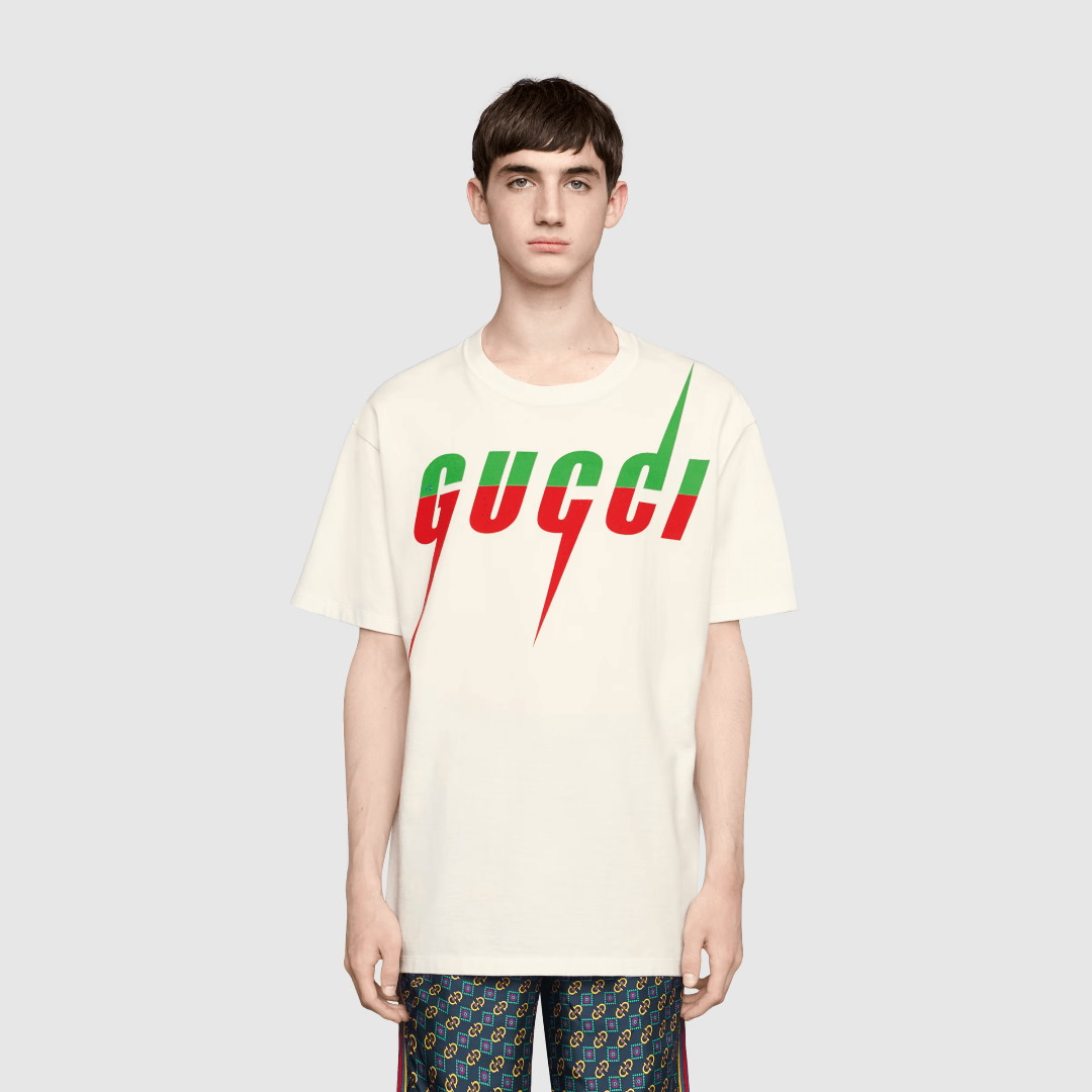 White Blade Print T-Shirt – designed with an oversized fit, this piece features the =Blade print—a recurring – LUX VERSE Luxury Designer Fashion Outlet