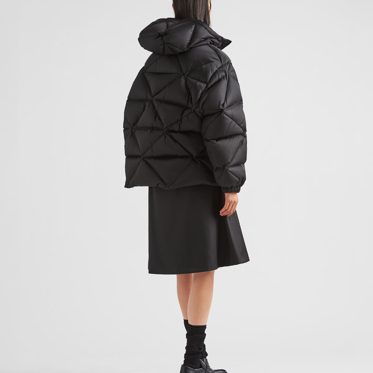 Oversized Re-Nylon Gabardine down jacket – the lettering logo is framed by the iconic triangle that is interpreted – LUX VERSE Luxury Designer Fashion Outlet