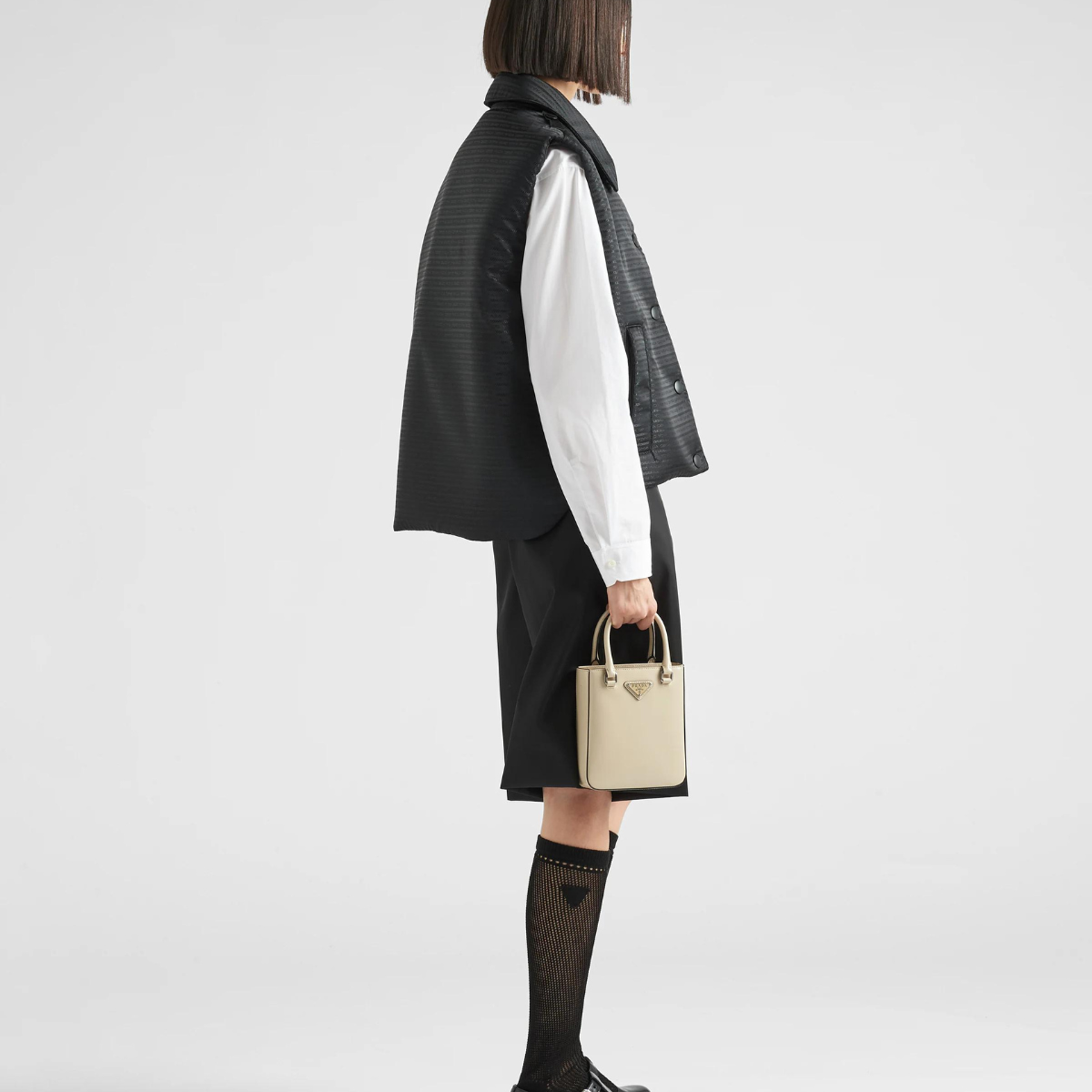 Padded Re-Nylon vest – versatile and functional, the multi-pocket design is enhanced by the enameled metal – LUX VERSE Luxury Designer Fashion Outlet