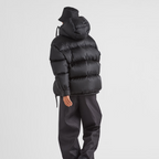 Re-Nylon hooded down jacket – padded with goose down, the garment is decorated with the iconic enameled metal – LUX VERSE Luxury Designer Fashion Outlet