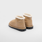 Shearling booties – the triangle logo, reimagined in always new ways, is presented here in embossed – LUX VERSE Luxury Designer Fashion Outlet