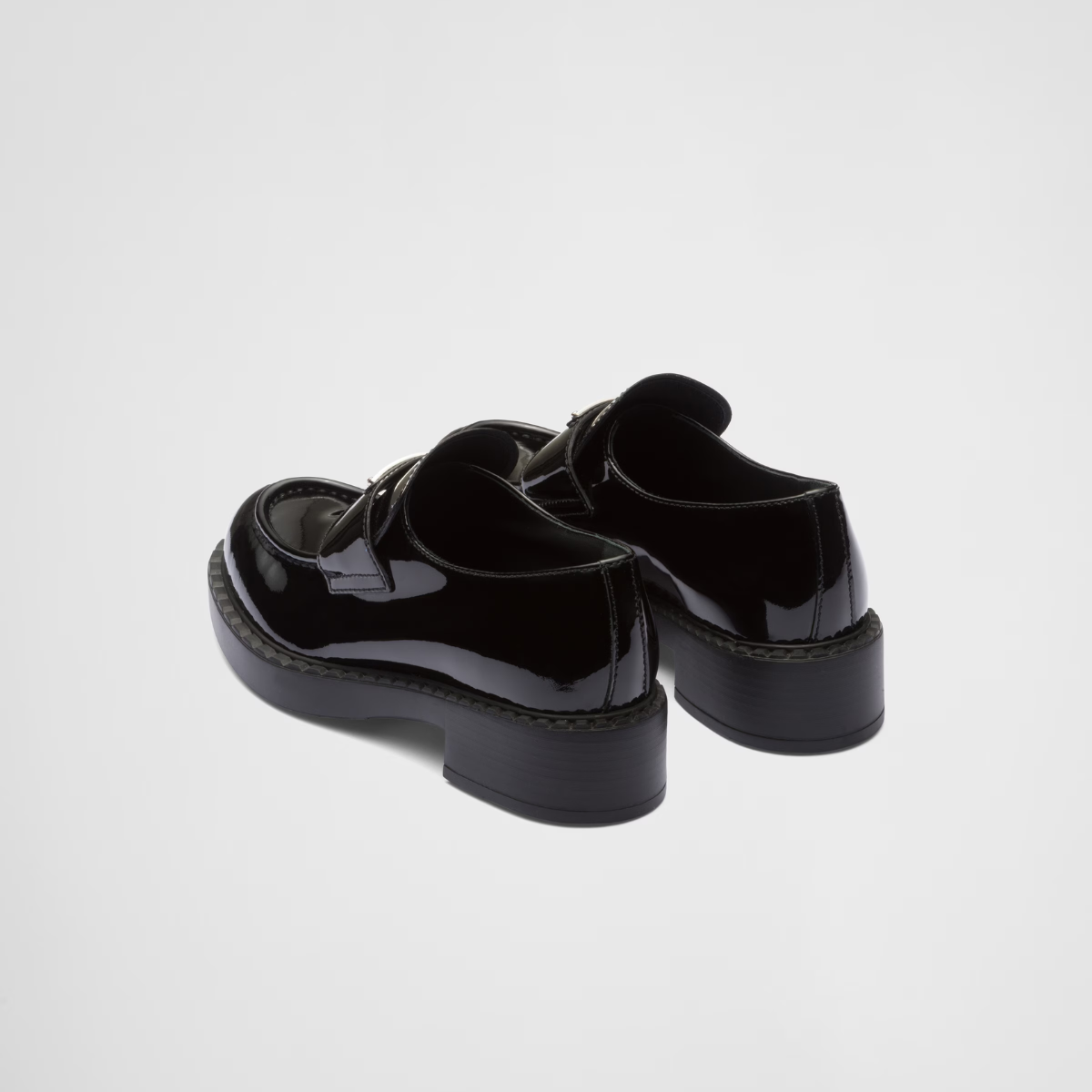 patent leather loafers – the triangle logo, first introduced on trunks designed by Mario, decorates the front – LUX VERSE Luxury Designer Fashion Outlet