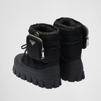 Re-Nylon gabardine après-ski boots with pouch – made of leather and nylon, an industrial fabric traditionally tied to the brand, – LUX VERSE Luxury Designer Fashion Outlet