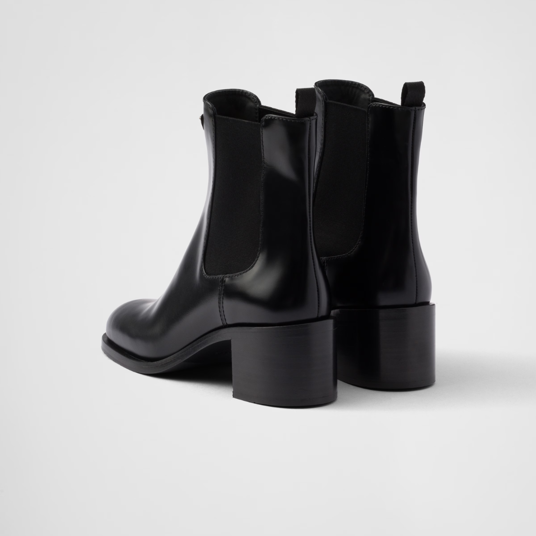 Brushed leather booties Black – upper with elasticized side gusset and pull tab Leather lining Enameled metal – LUX VERSE Luxury Designer Fashion Outlet
