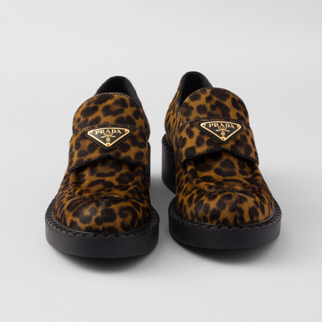 Chocolate printed leather loafers – the leopard-print leather gives the iconic shoes a new attitude, and the triangle – LUX VERSE Luxury Designer Fashion Outlet