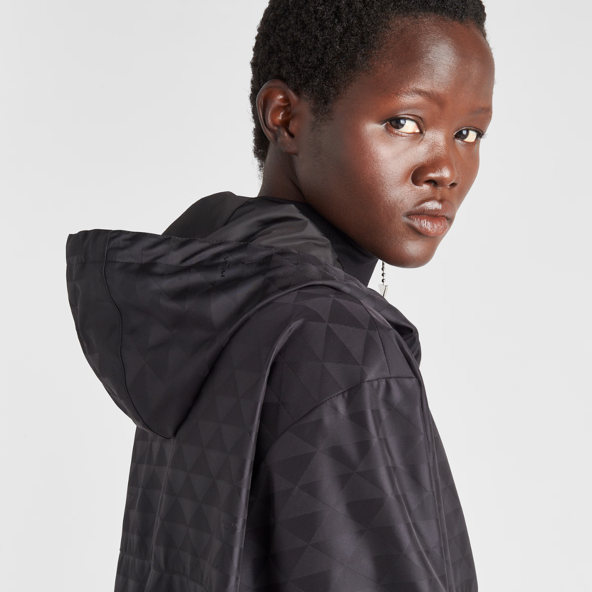Printed Re-Nylon jacket – here, the geometric design is transformed into a sophisticated yet modernist pattern – LUX VERSE Luxury Designer Fashion Outlet