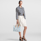 OnTheGo MM Blue – the two top handles, and concealed shoulder straps, are in cowhide leather, as are – LUX VERSE Luxury Designer Fashion Outlet