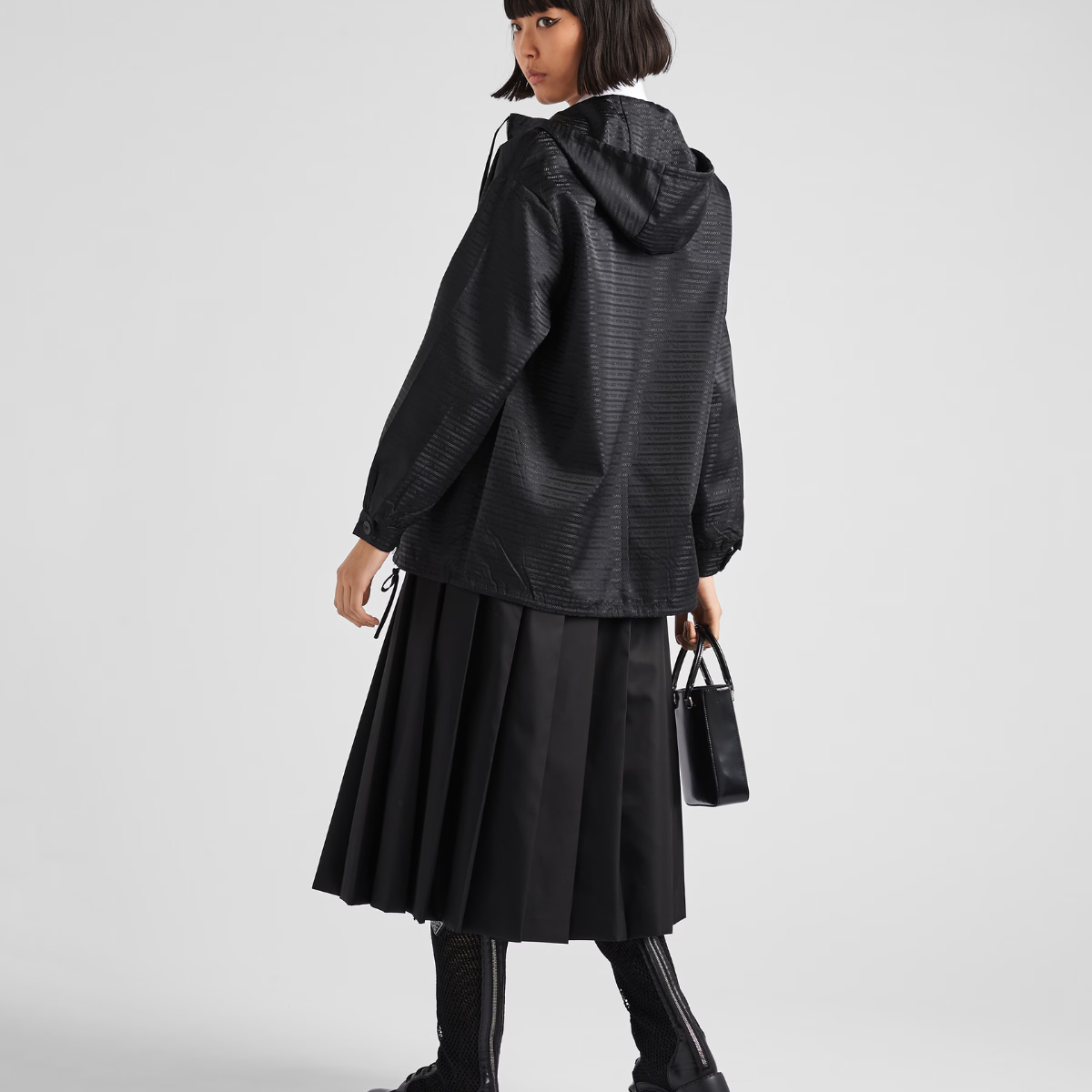 Re-Nylon hooded blouson jacket – the enameled metal triangle logo adds an iconic note – LUX VERSE Luxury Designer Fashion Outlet