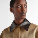 Cropped canvas jacket – the utility-inspired garment, enriched by patch pockets and leather collar, is – LUX VERSE Luxury Designer Fashion Outlet