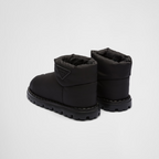 Re-Nylon booties – the triangle logo, reimagined in always new ways, is presented here in embossed – LUX VERSE Luxury Designer Fashion Outlet