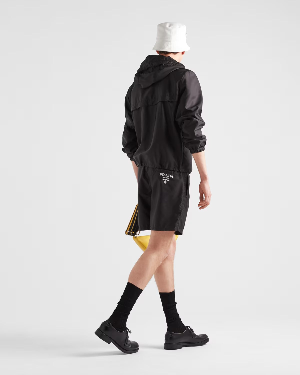 Re-Nylon swim trunks – the embroidered lettering logo adds an iconic touch to the garment, accompanied by – LUX VERSE Luxury Designer Fashion Outlet